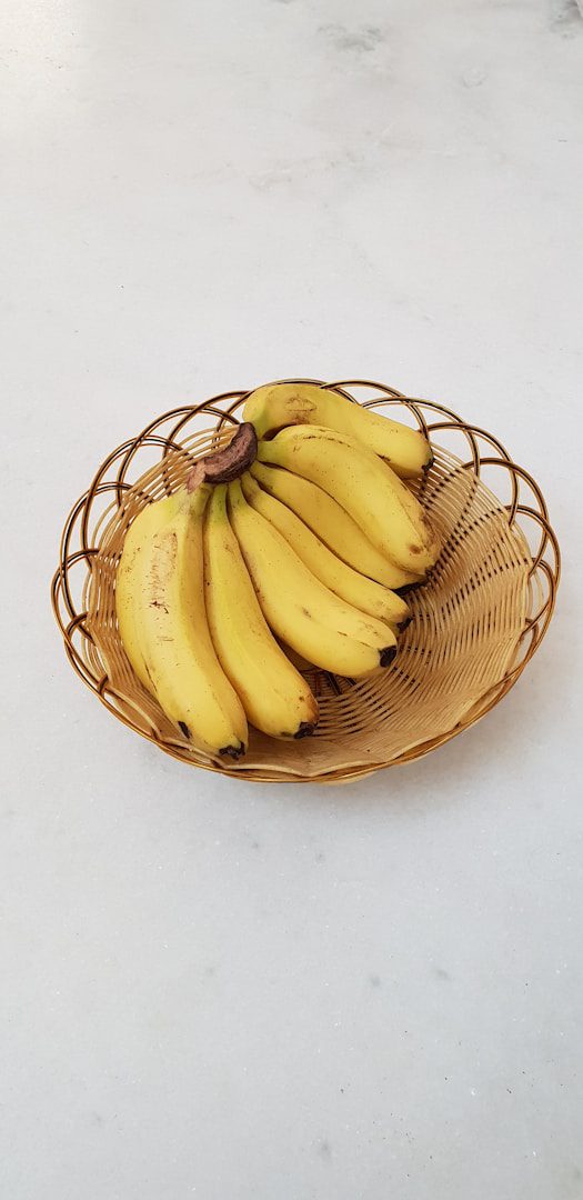 Bananas are best suited to a dry, cooler environment, but not a refrigerator. It is ideal to leave them in a bowl on the counter.
