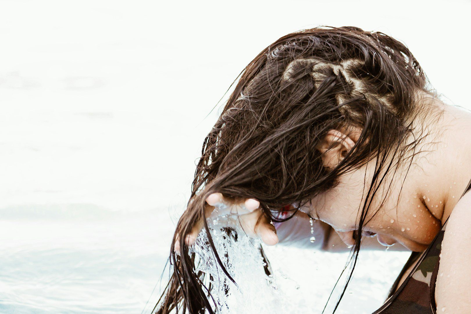 You shouldn't wash your hair every day, but waiting a week isn't advisable either.